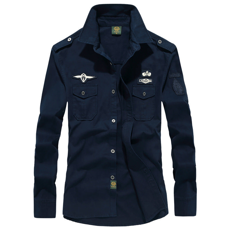Men's utility shirt jacket with shoulder flaps, chest flap pockets, and badge applications Chichicherry