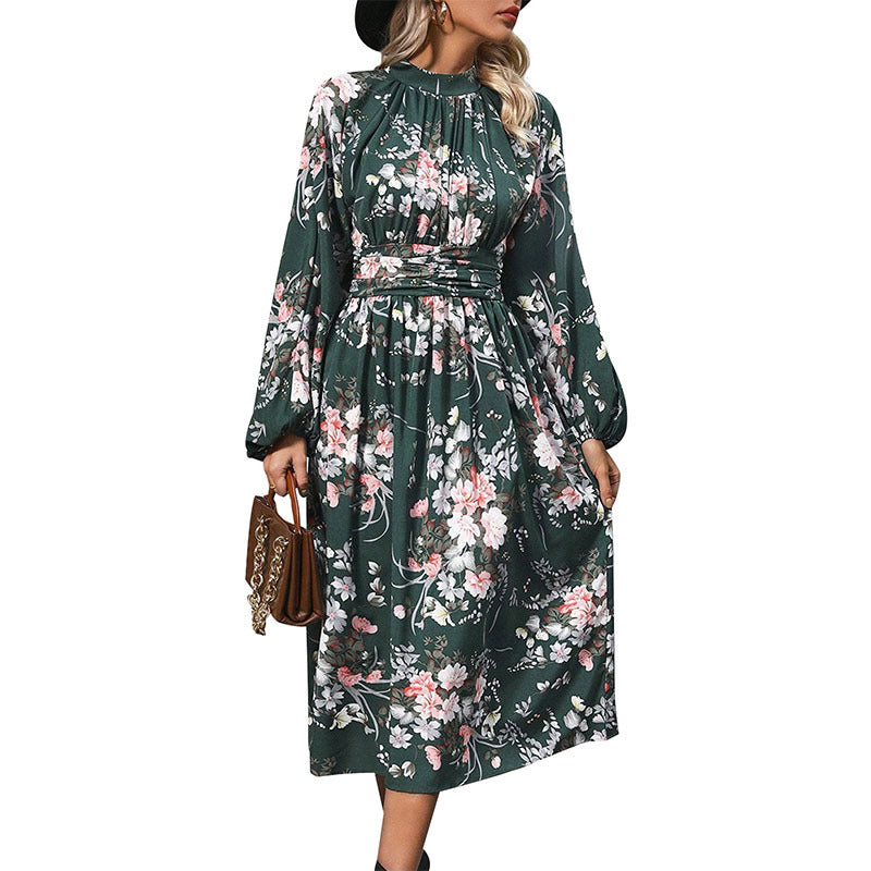Women's midi dress with floral all-over print, stand collar and draped waist belt.