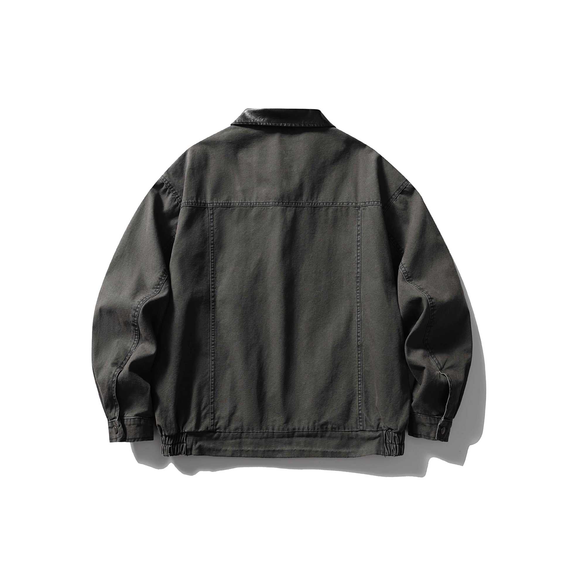 Men's tailored canvas blouson with contrasting leather collar and elastic hem.