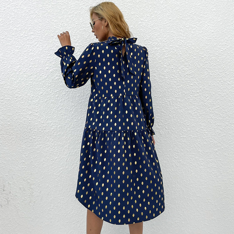 Women's tailored tiered mini dress with stand-up collar, puff sleeves, and metallic dots.