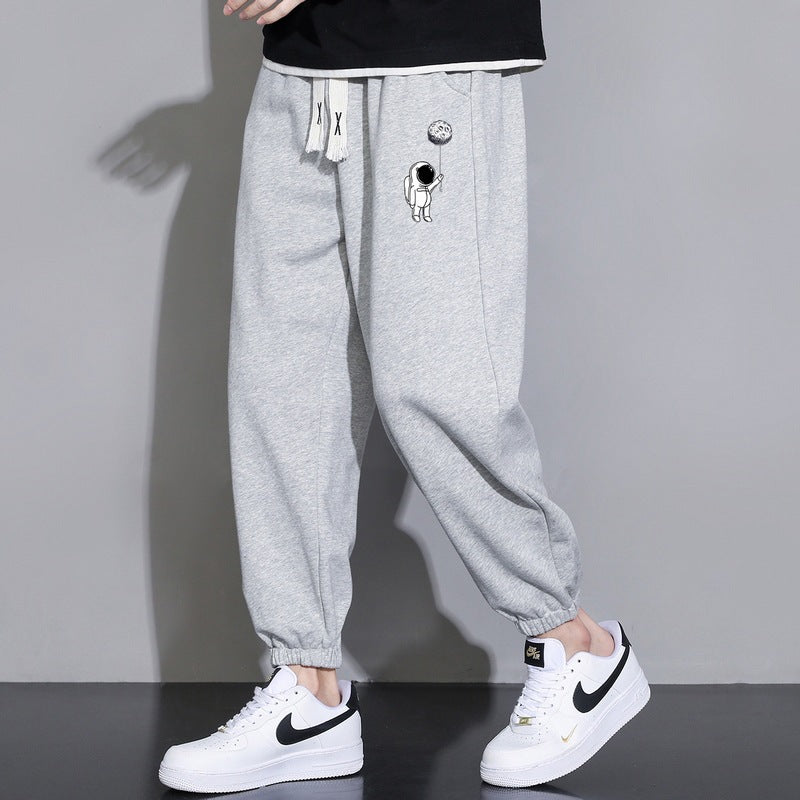 Men's Loose Jogging Pants with Astronaut Print, Drawstring Waistband and Elastic Cuffs Chichicherry