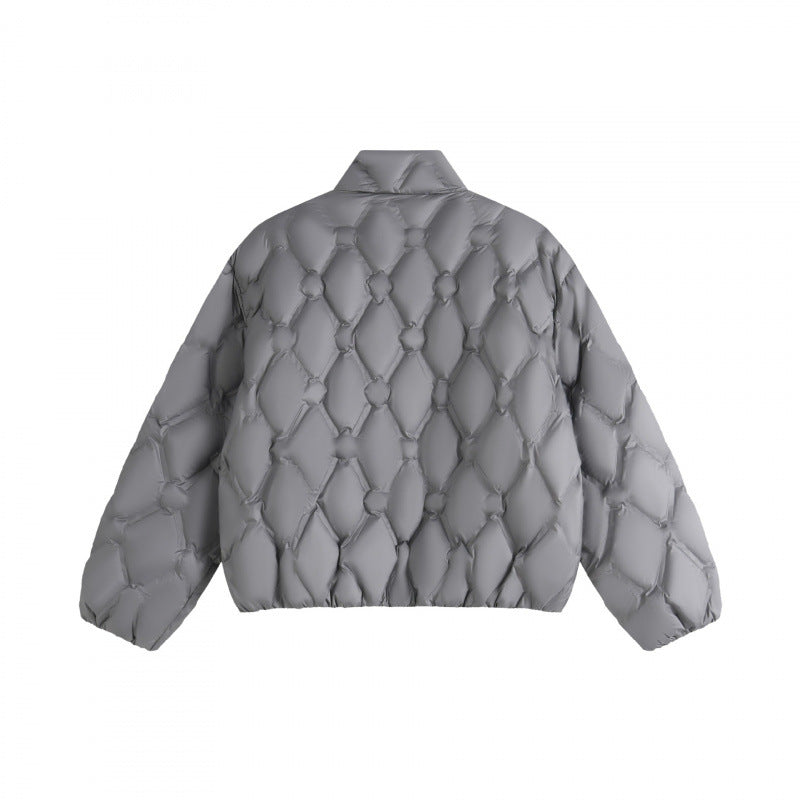 Unisex short cut quilted jacket in boxy cut with diamond quilting and diagonal zip pockets Chichicherry