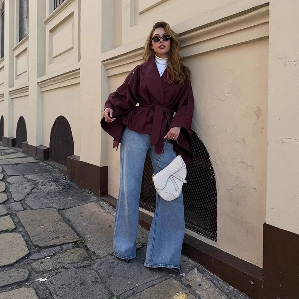 Women's short trench-style jacket with belted waist, oversized sleeves, and boxy cropped silhouette Chichicherry