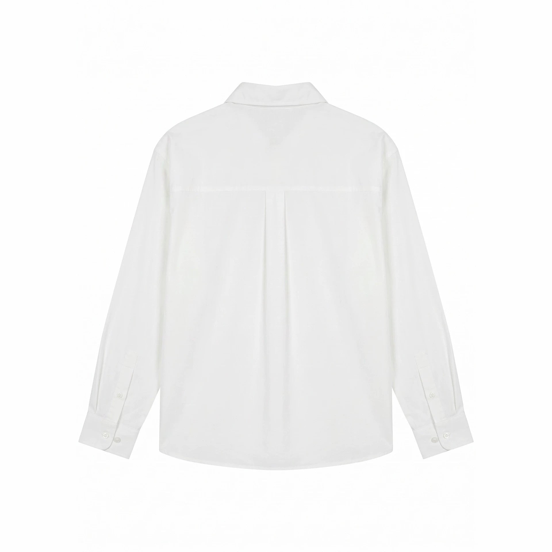 Women's oversized shirt blouse with fine embroidery appliqués and extended hem.