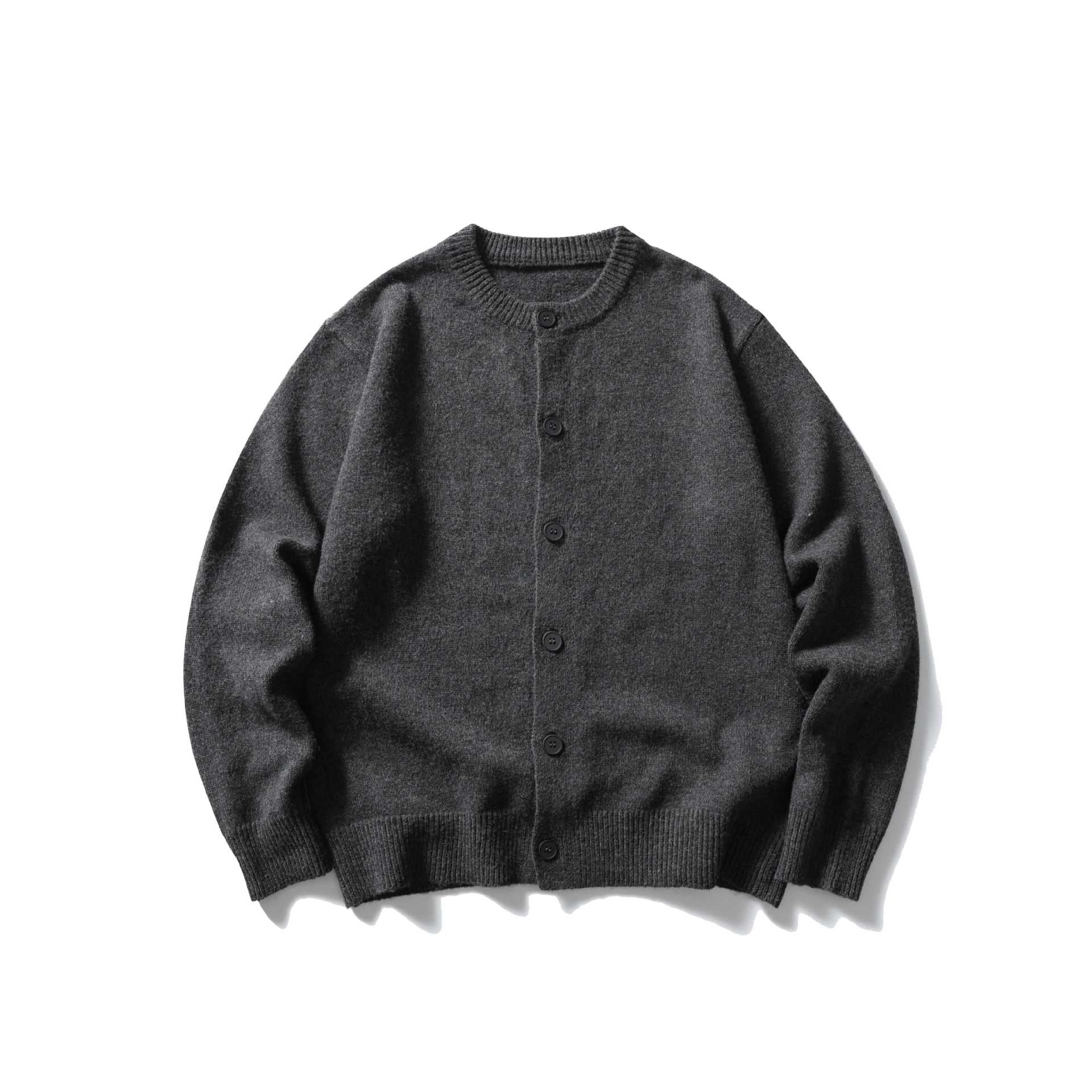 Women's fine knit cardigan with round neckline, full button placket and wide ribbed cuffs.