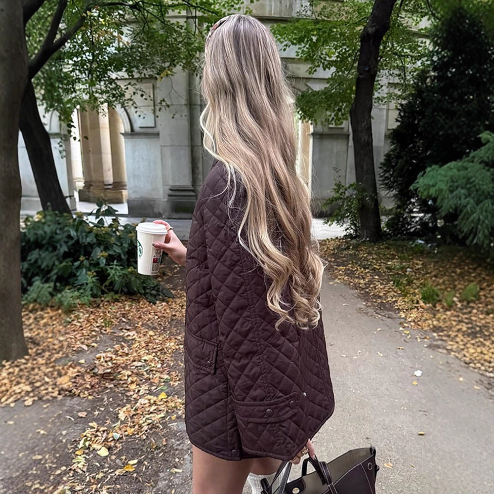 Women's oversized quilted jacket in coat style with snap button placket and patch flap pockets Chichicherry