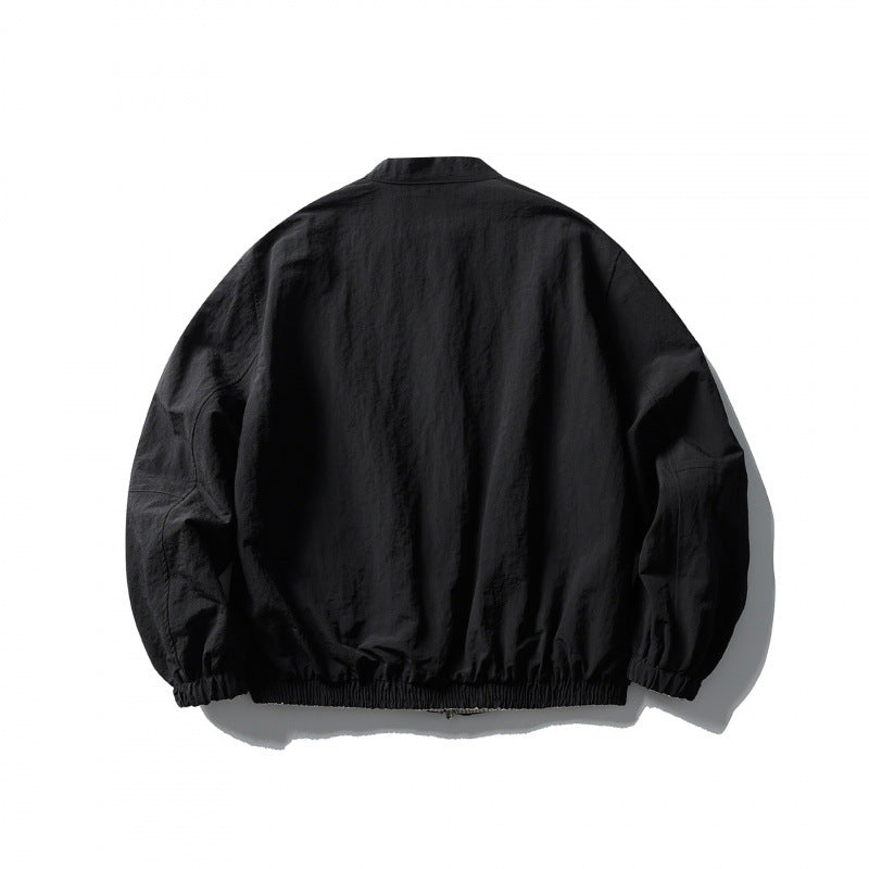 Unisex Light Oversized Bomber Jacket Made of Textured Fabric with Stand-Up Collar and Elastic Hem Chichicherry