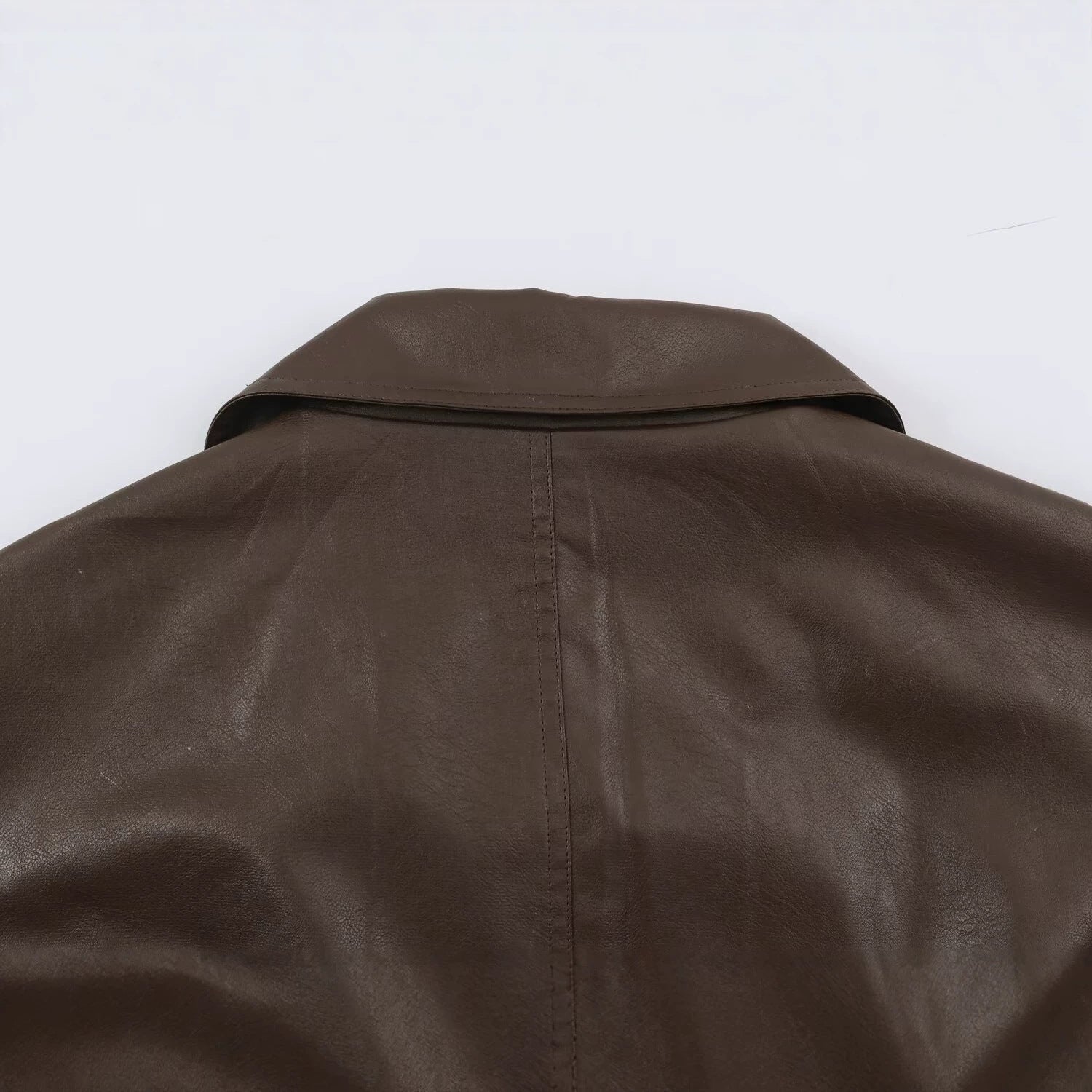 Women Tailored Leather Look Jacket with Asymmetrical Button Placket and Ties Belt Chichicherry