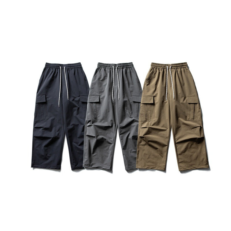 Unisex Wide Cargo Utility Pants in Baggy Cut with Elastic Drawstring Waist and Generous Flap Pockets