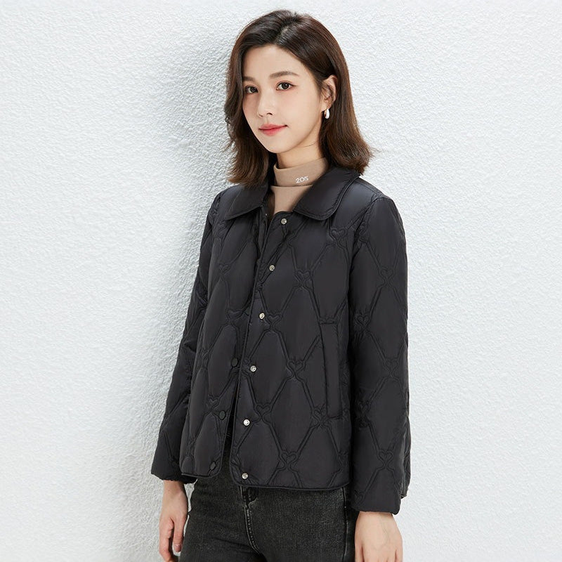 Women Short Cut Quilted Jacket with Decorative Stitching and Rounded Hem Chichicherry