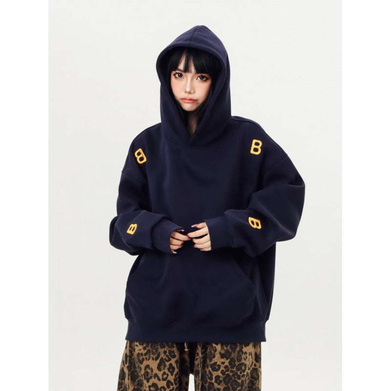 Unisex Oversized Kapuzenpullover mit großflächigem Intarsien‑Blockprint und geripptem Saum Chichicherry
