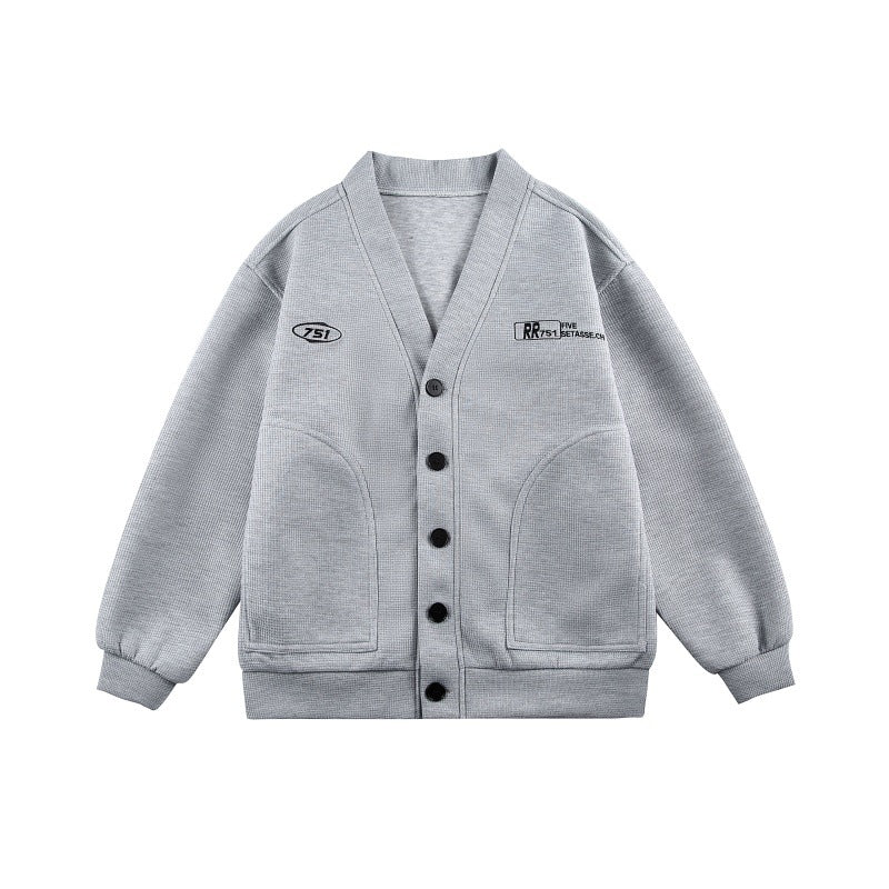 Unisex Boxy knit cardigan in waffle knit with V-neck, continuous button placket, and applied round pockets Chichicherry
