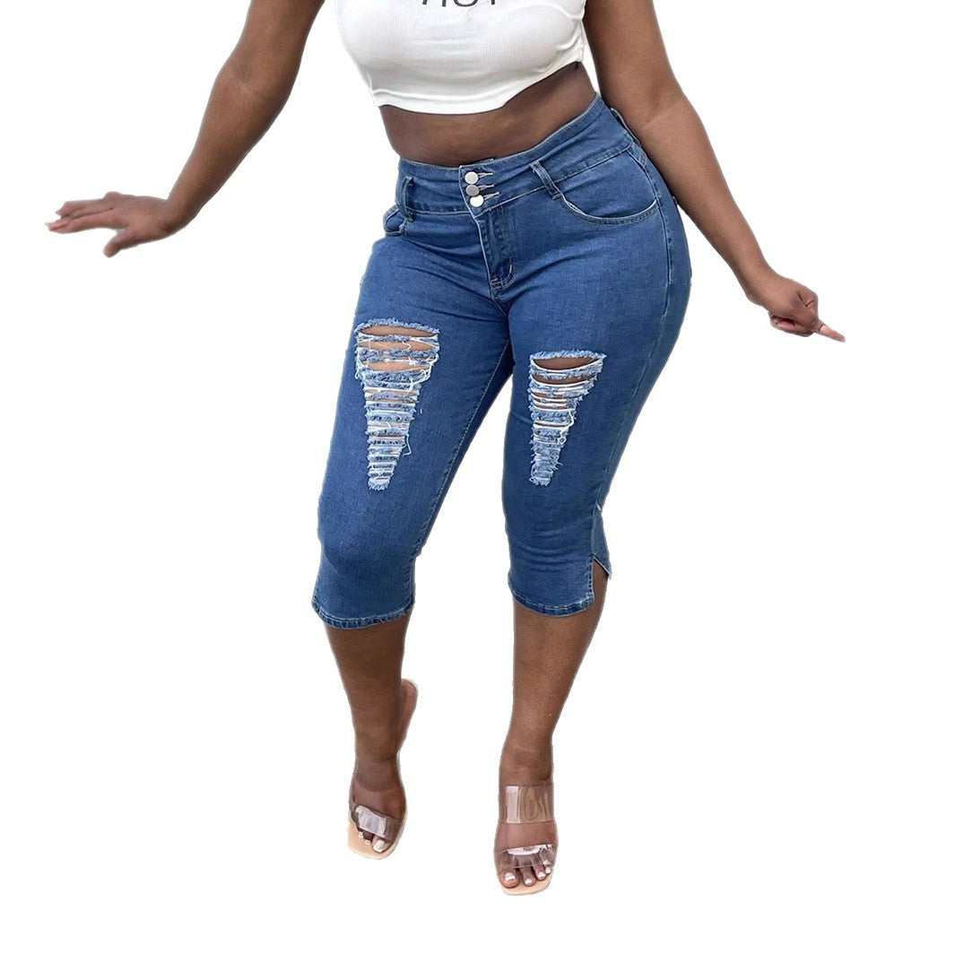 Women's high-waisted, three-quarter length stretch jeans with destroyed inserts and side seam slit Chichicherry