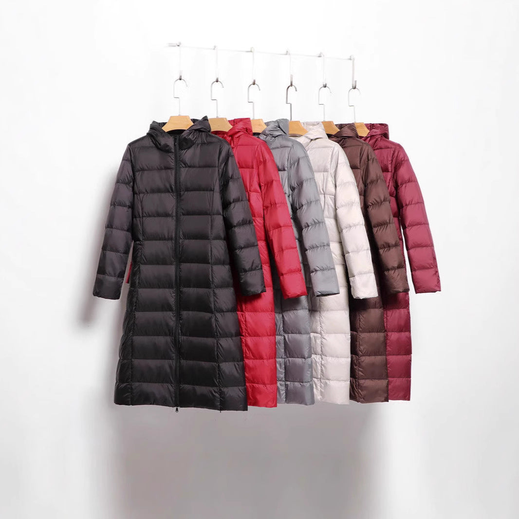 Women's longer quilted coat with hood and light thermal insulation Chichicherry