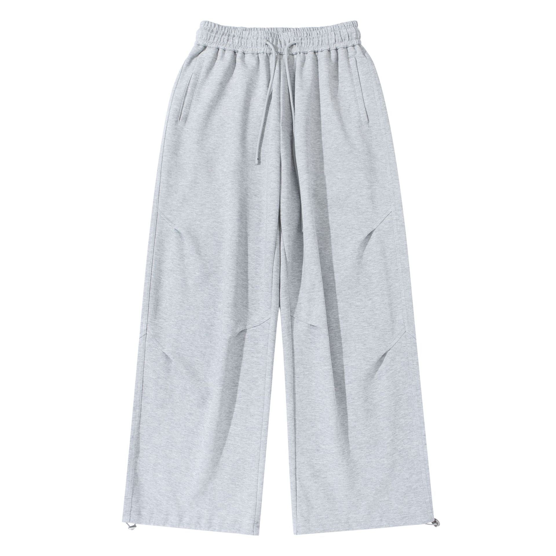 Unisex Wide French-Terry Sweatpants with elastic drawstring waistband, side pockets, and adjustable hem.