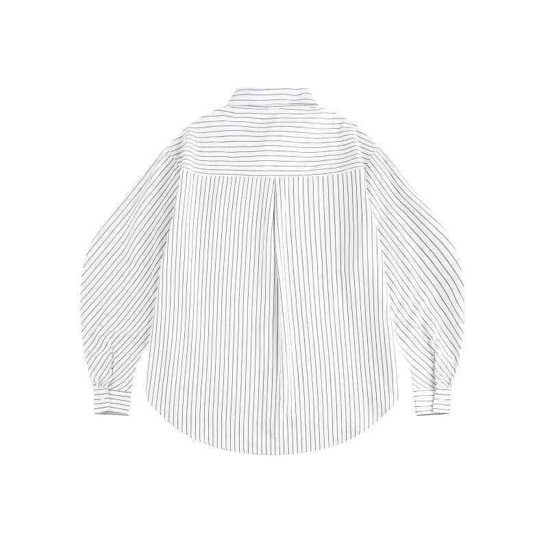 Women's oversized shirt blouse with fine pinstripes, balloon sleeves, and rounded hem.