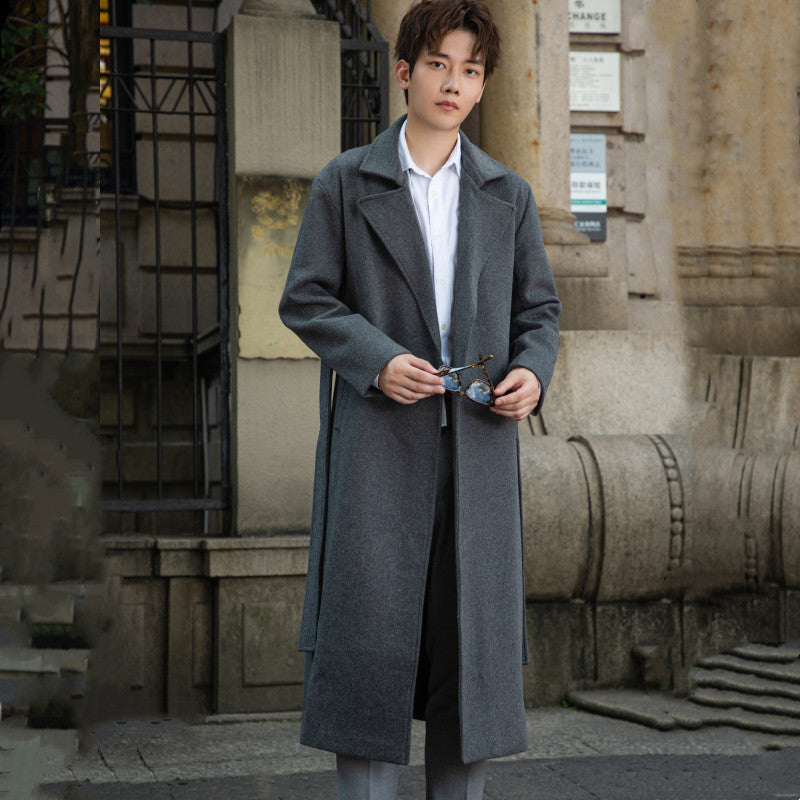 Men's long cut wool coat in minimalist design with generous shawl collar and concealed button placket Chichicherry