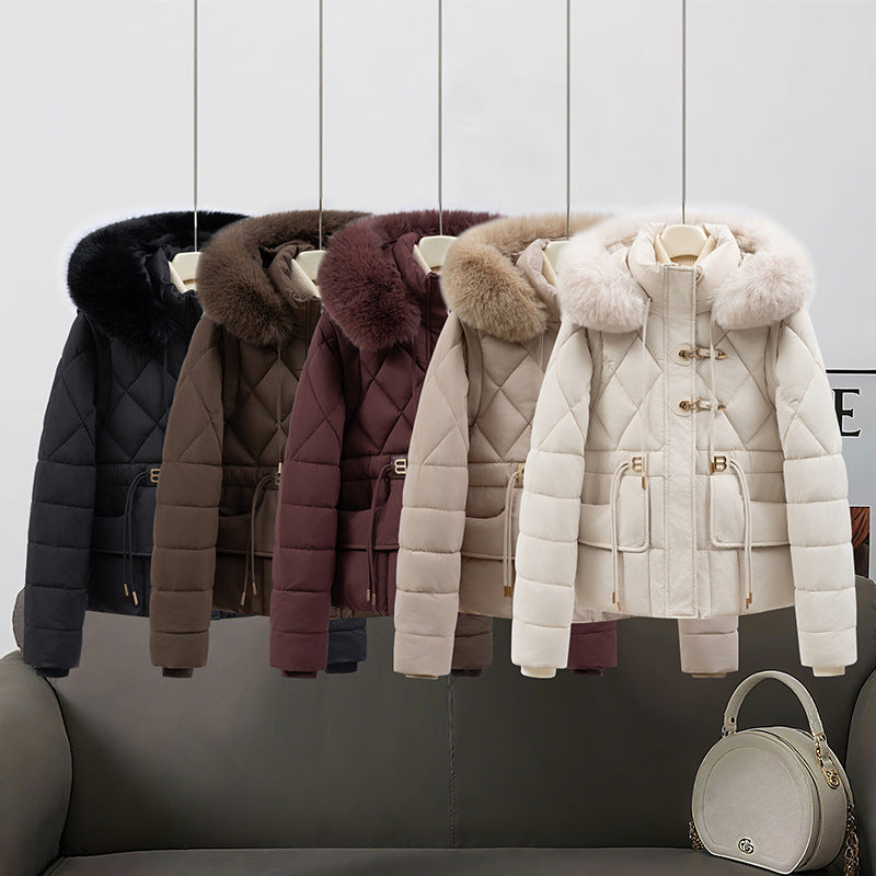 Women's short quilted hooded jacket with voluminous faux fur trim, drawstring waist, and flap pockets Chichicherry