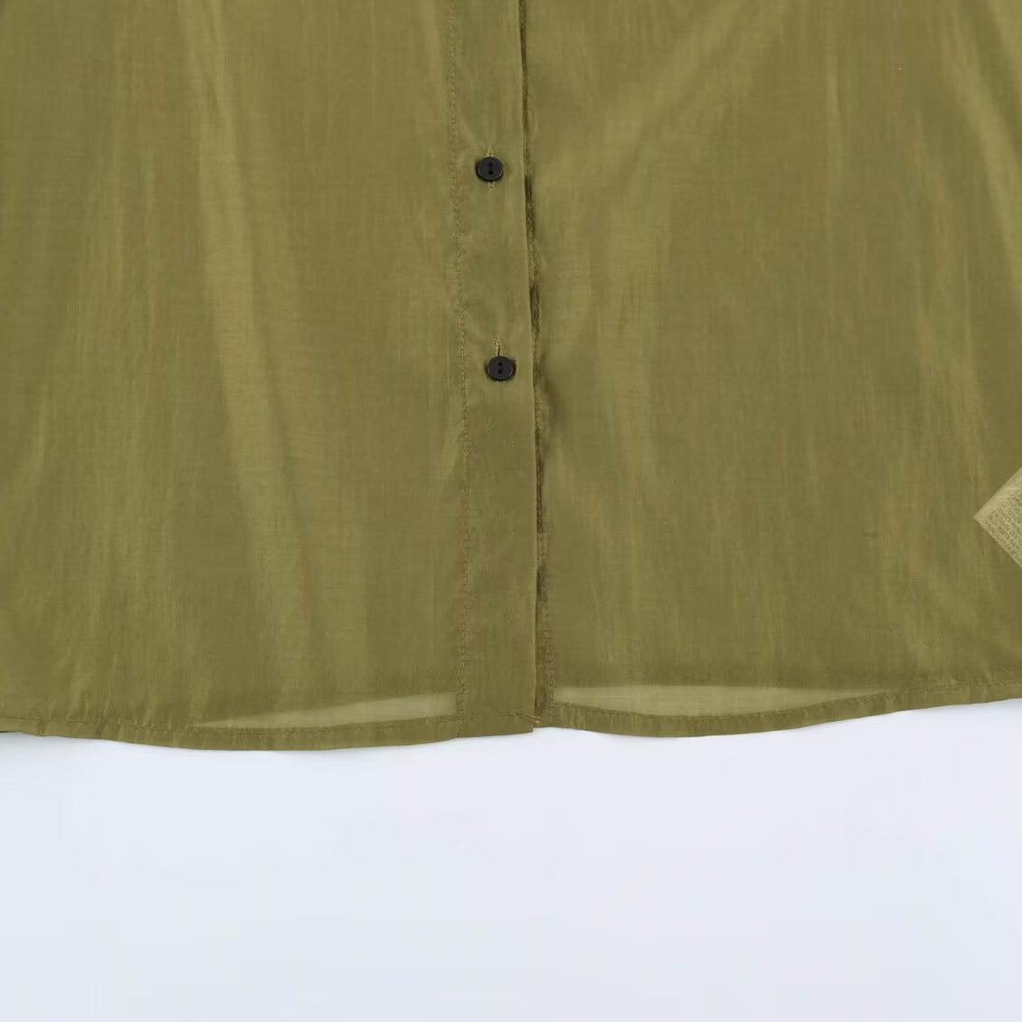 Women's silk effect blouse with voluminous sleeves, layered ruffles, and smocked cuffs