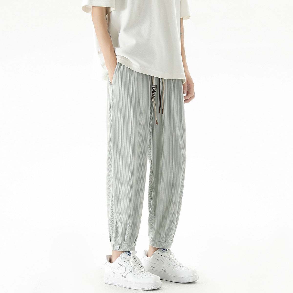 Men's loose-fitting leisure pants with drawstring, fine ribbed structure, and buttoned cuffs Chichicherry