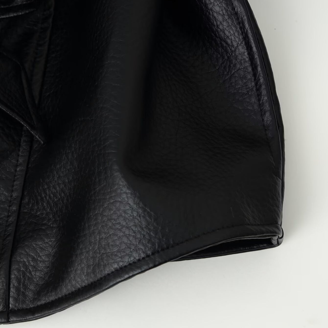 Women's short blazer made of vegan leather with shawl collar and waist tie belt Chichicherry