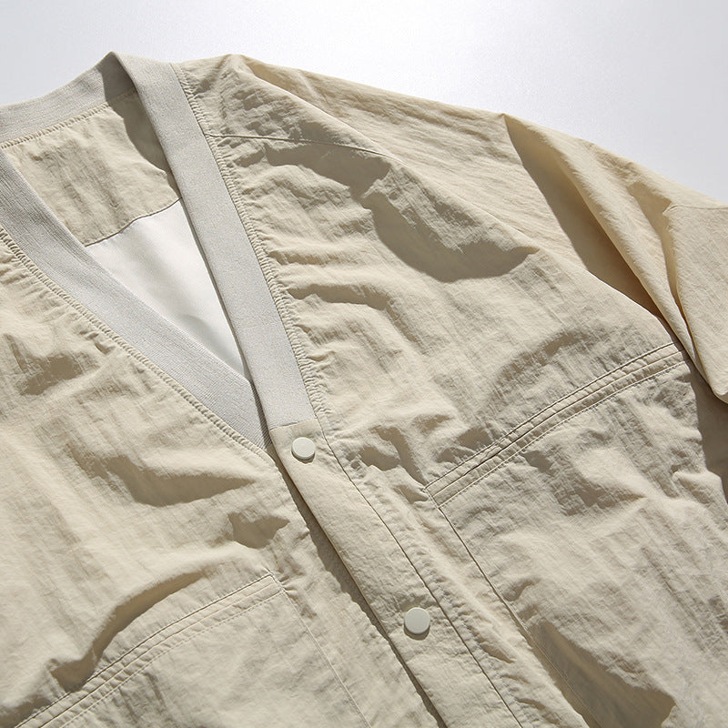 Unisex Oversized Lightweight Transitional Jacket with V-Neck and Snap Button Placket Chichicherry