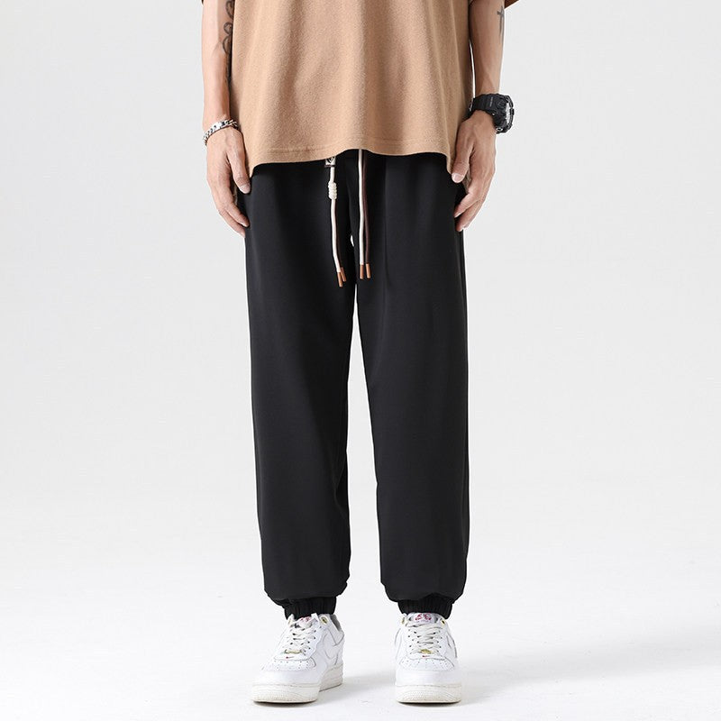 Men's Wide Jogging Pants in a Loose Fit with Adjustable Drawstring, Elastic Ankle Cuffs, and Soft Touch Chichicherry