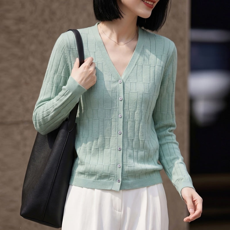 Ladies V-neck fine knit cardigan with structured block design and continuous button placket Chichicherry