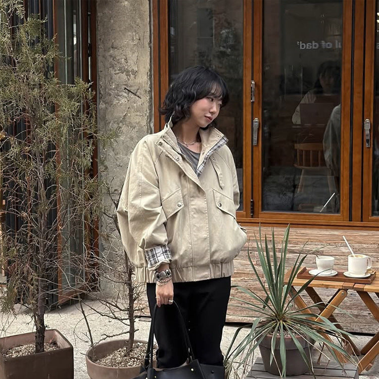 Women’s short bomber jacket with stand-up collar, chin strap, and checkered sleeve lining Chichicherry