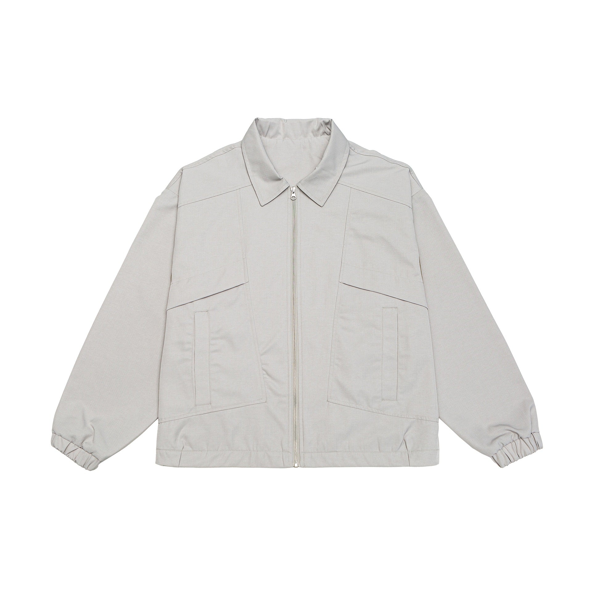 Unisex short jacket in boxy cut with shirt collar, visible metal zipper and utility patch pockets Chichicherry