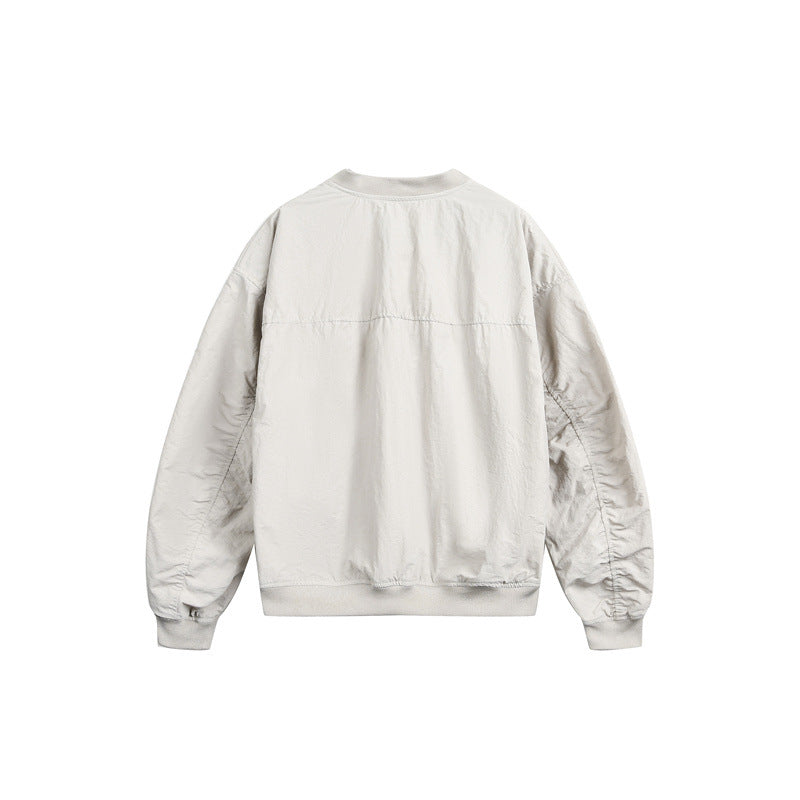 Unisex short cut lightweight nylon bomber jacket with utility pockets and ribbed hem Chichicherry