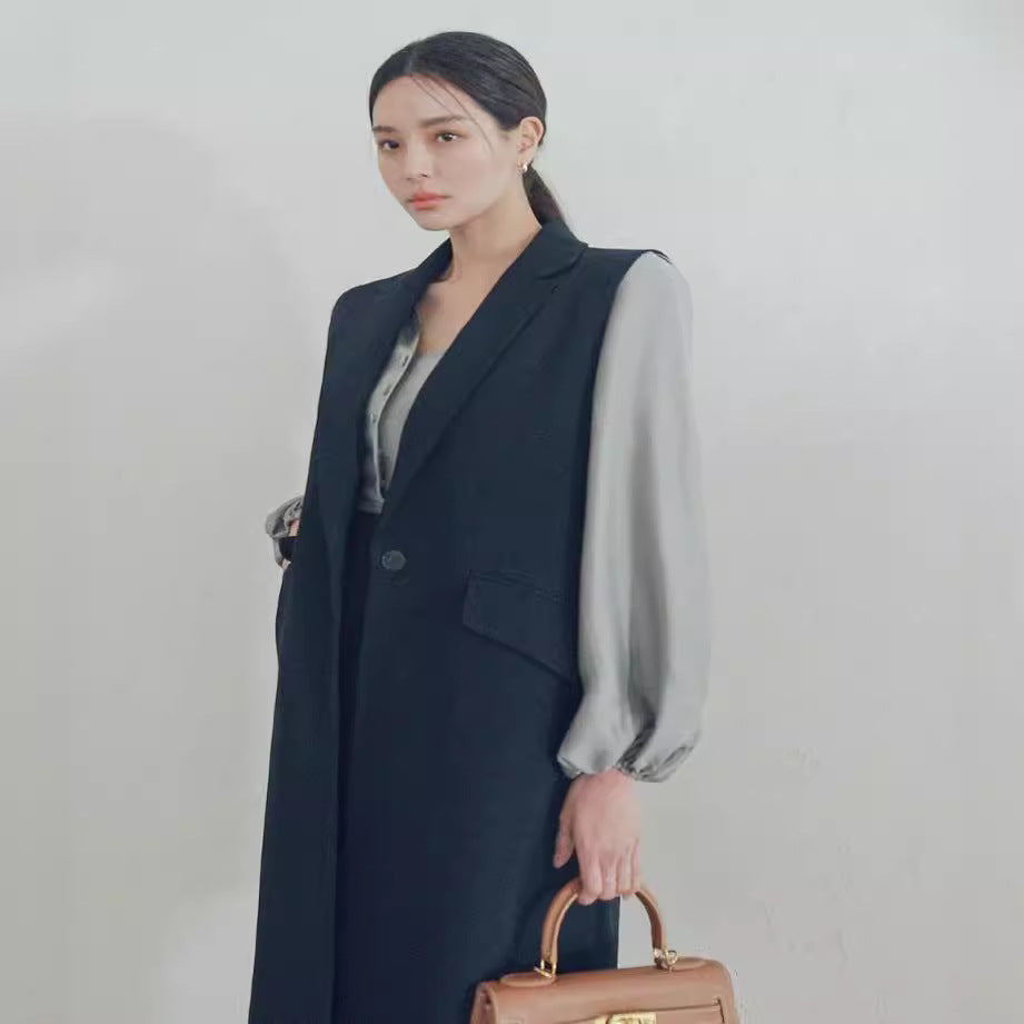Women's sleeveless long vest in tailoring with flap pockets and single-breasted button placket Chichicherry