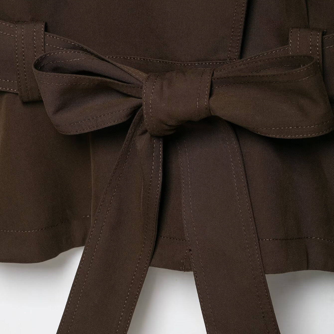 Women's short trench coat with high stand-up collar, tie belt, and asymmetrical button placket Chichicherry