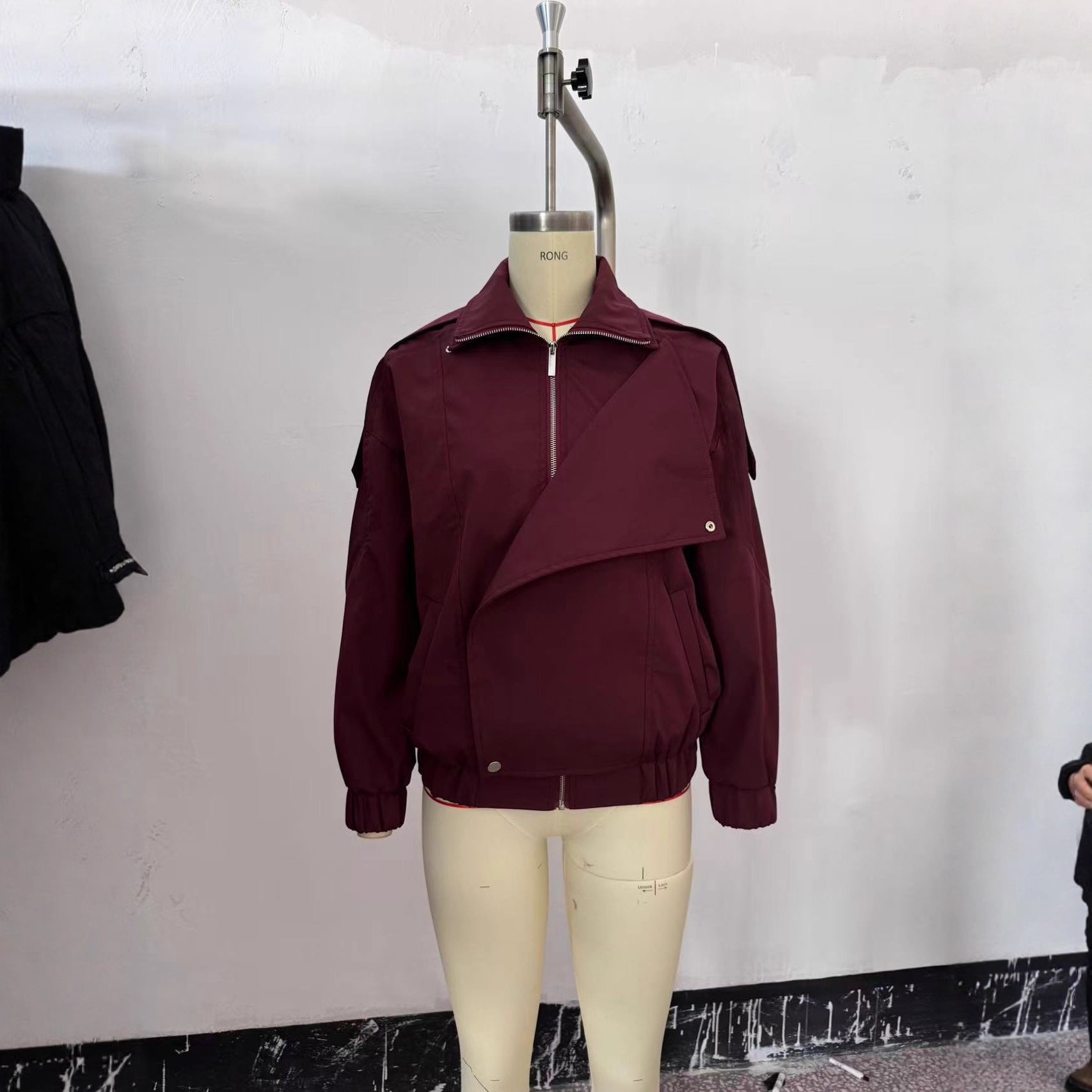 Women's oversized bomber jacket with asymmetric placket front, standing collar, and drawstring hem Chichicherry