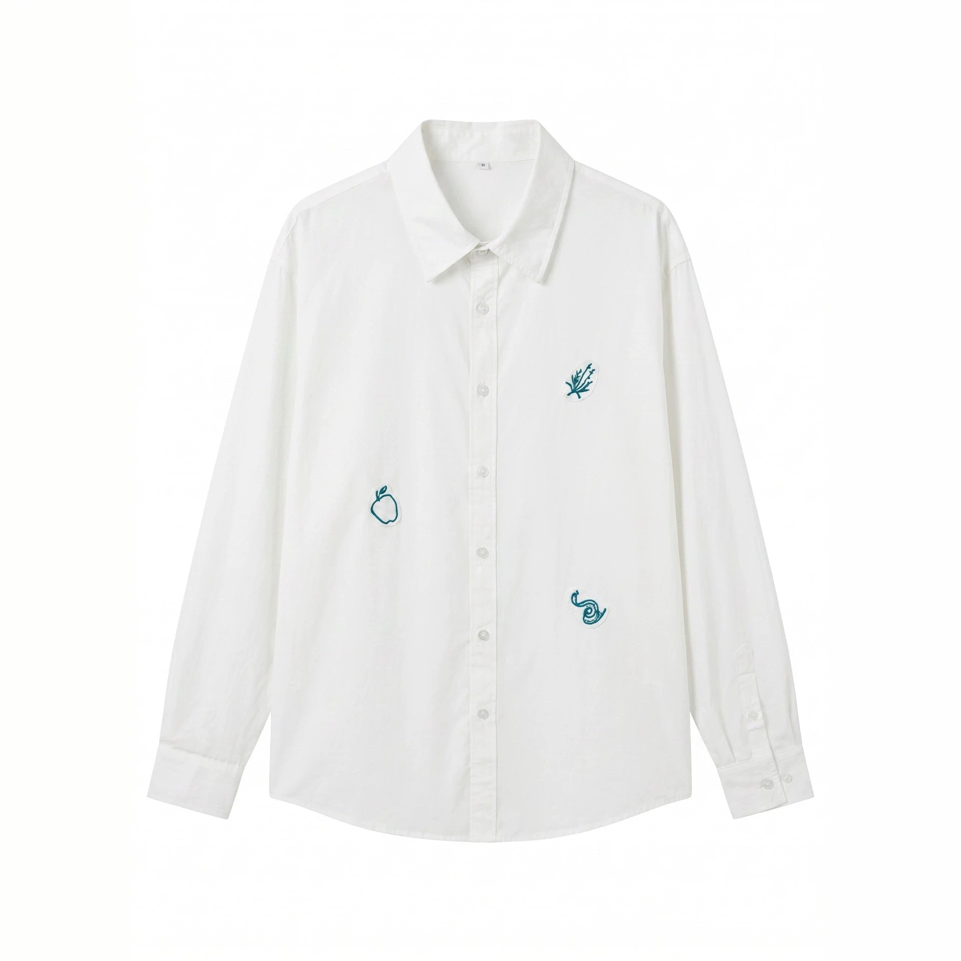 Women's oversized shirt blouse with fine embroidery appliqués and extended hem.