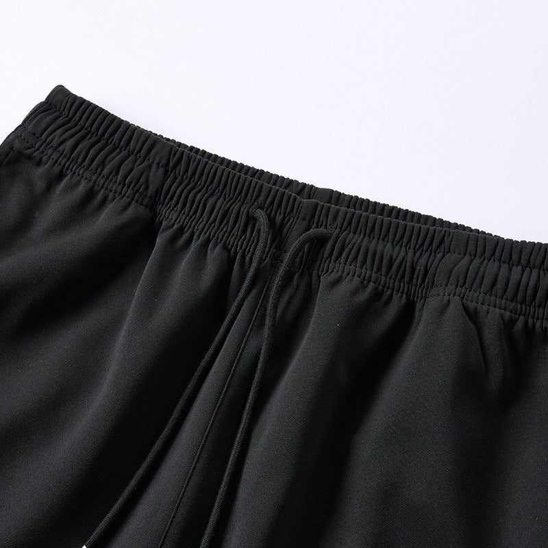 Men's loose baggy training pants with drawstring waistband, elastic comfort waistband, and side stripe detail Chichicherry