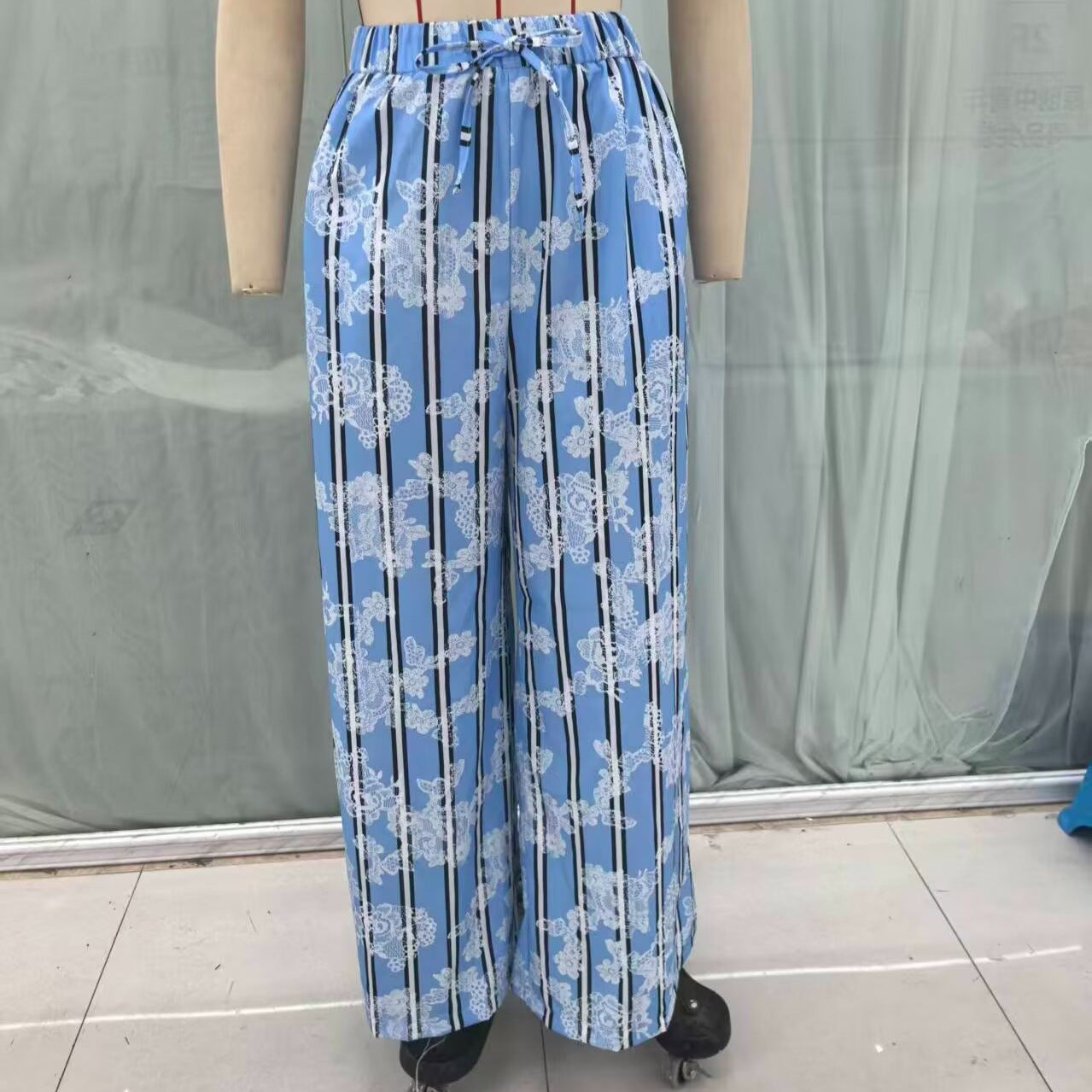 Women's wide palazzo pants with elastic drawstring waistband and floral lace look Chichicherry