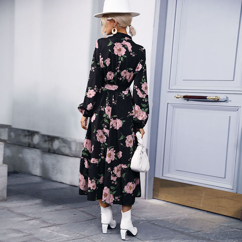 Women's maxi dress with floral allover print, stand collar, long balloon sleeves and ruffle detail.