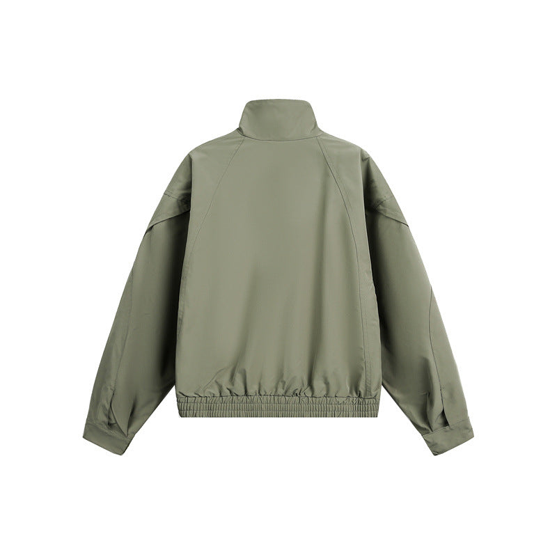 Unisex short jacket in minimalist tech fabric with funnel collar and concealed front placket Chichicherry