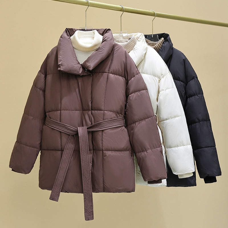 Women's quilted winter jacket with waist belt, stand-up collar, and ribbed cuffs Chichicherry