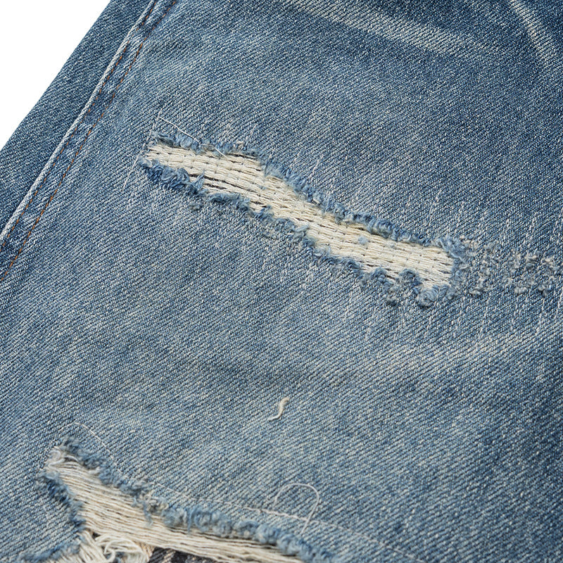 Women's high-waisted denim pants in a wide, cropped cut with a used effect and patch front pockets Chichicherry