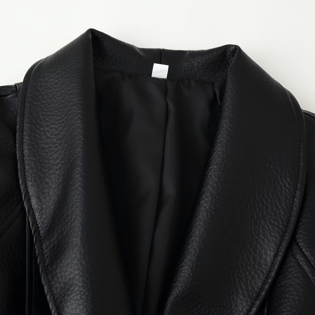 Women's short blazer made of vegan leather with shawl collar and waist tie belt Chichicherry