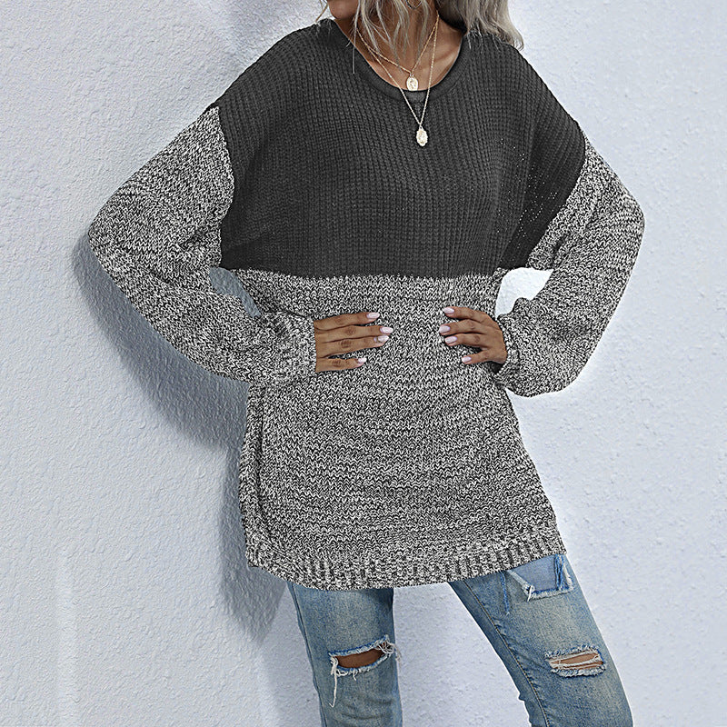 Women's oversized knitted sweater with color block look, round neckline, and mottled textured knit.