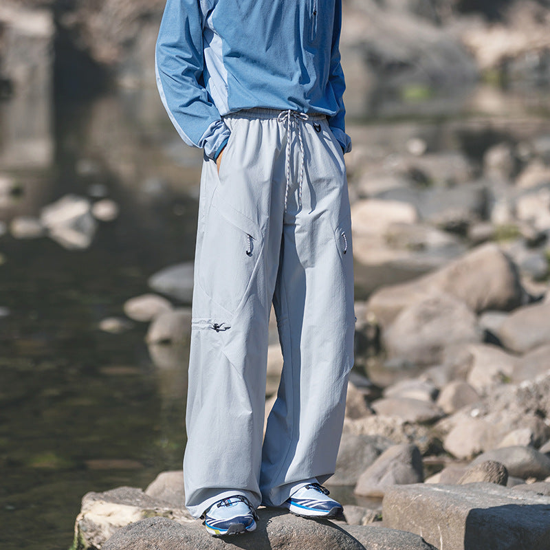 Men's loose technical cargo pants with drawstring, zipper pockets, and adjustable hem Chichicherry
