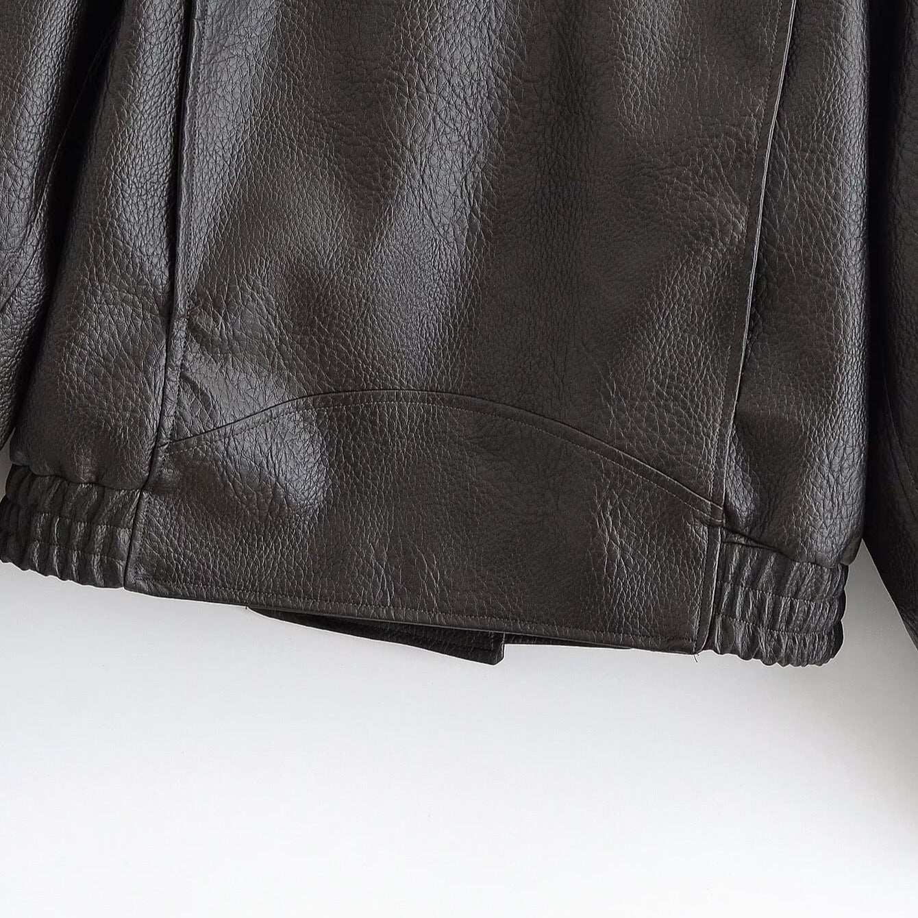 Women’s short jacket in aviator style made of synthetic leather with high standing collar, shoulder straps, and fitted ribbed hem Chichicherry