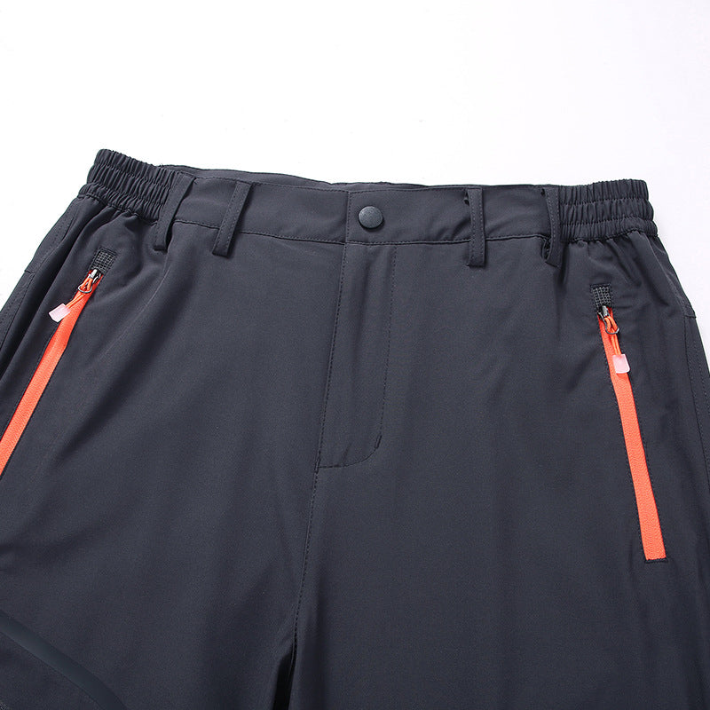 Men's softshell outdoor pants with reinforced knee sections, zippered pockets, and elastic waistband Chichicherry