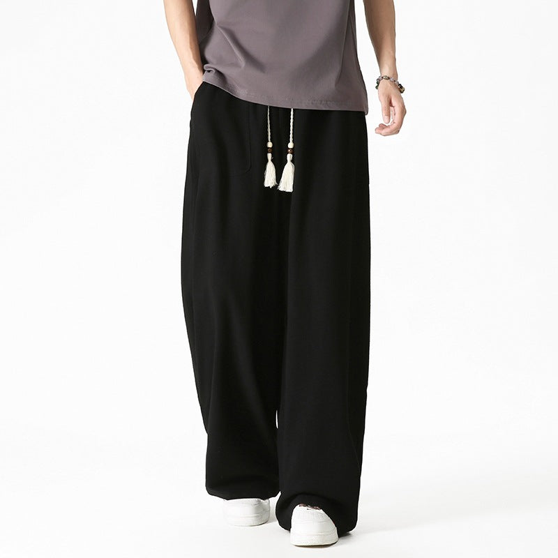 Men's loose-fitting lounge pants with tassel cord, elastic waistband, and patch pockets Chichicherry