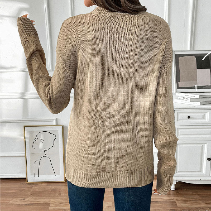 Women's oversized knit sweater with cherry intarsia, lightly distressed look and round neck.