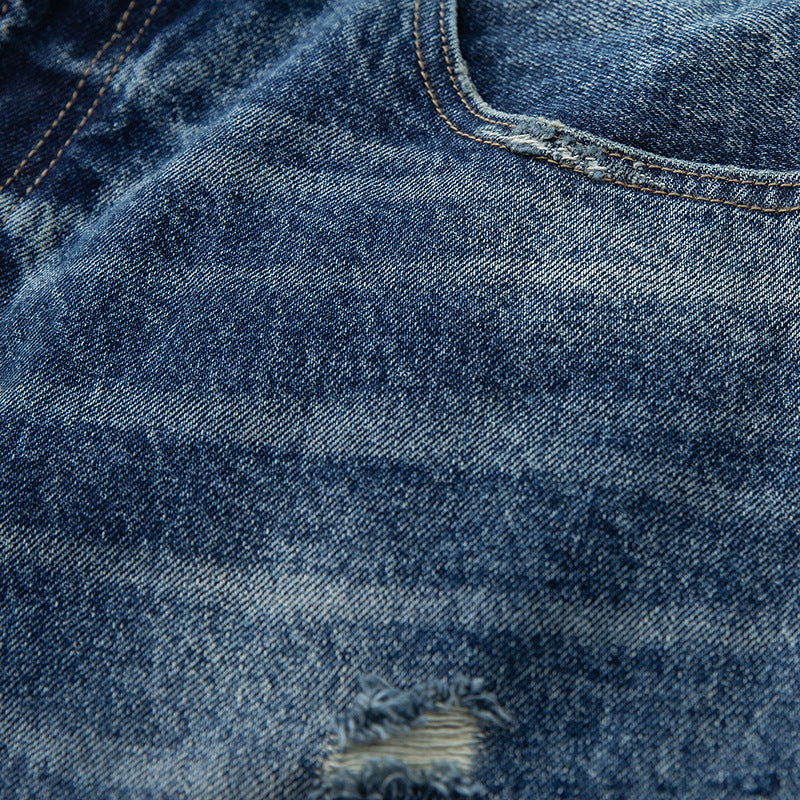 Women's high-waisted wide-cut jeans in a used look with button closure and subtle rips