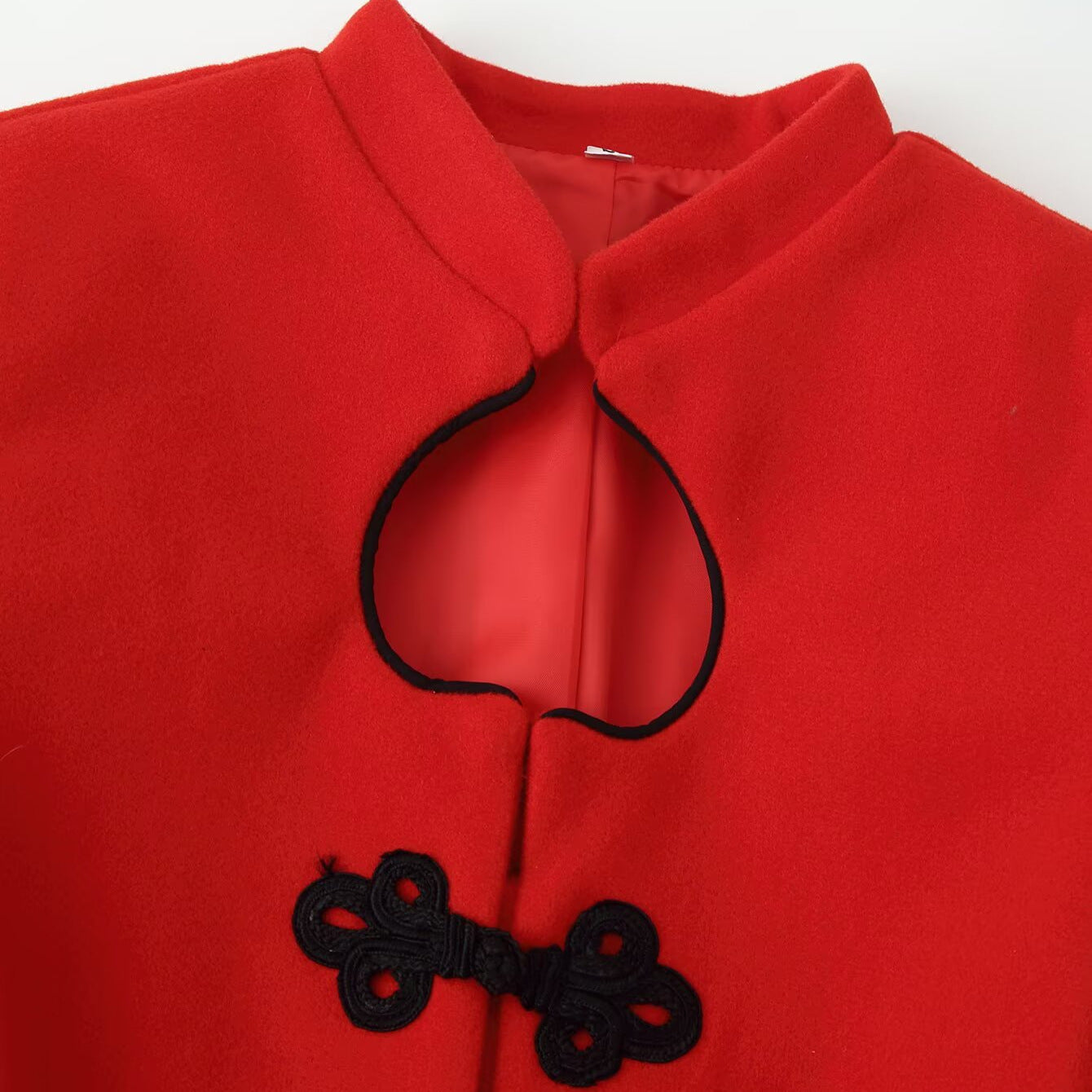 Women's short jacket in mandarin style with drop neckline and decorative knot closures Chichicherry